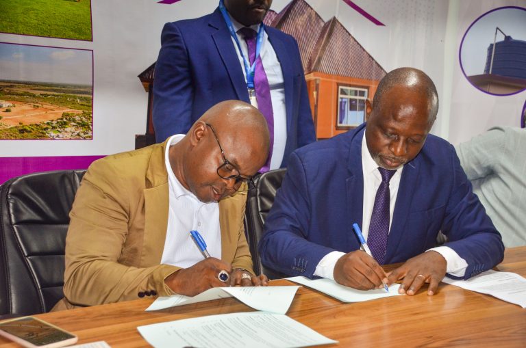 MAENDELEO BENKI WASAINI MKATABA NA KAWASSO KUWAWEZESHA VIWANJA WAMACHINGA DSM